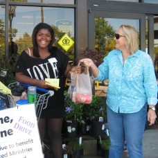 Shopper Donating to Each One Feed One 2012